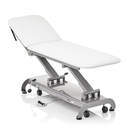 white exam table with longer head rest