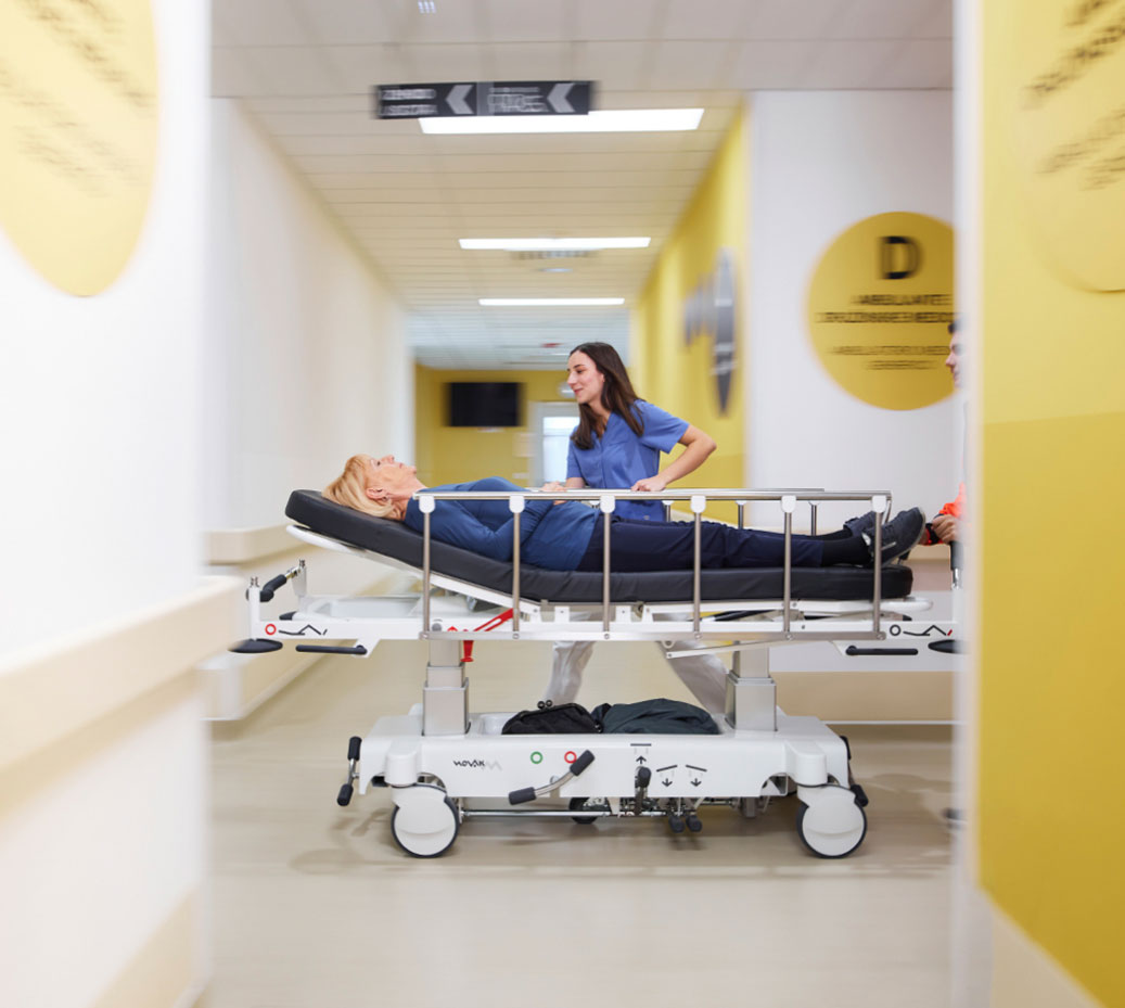 nurse walking along the stretcher