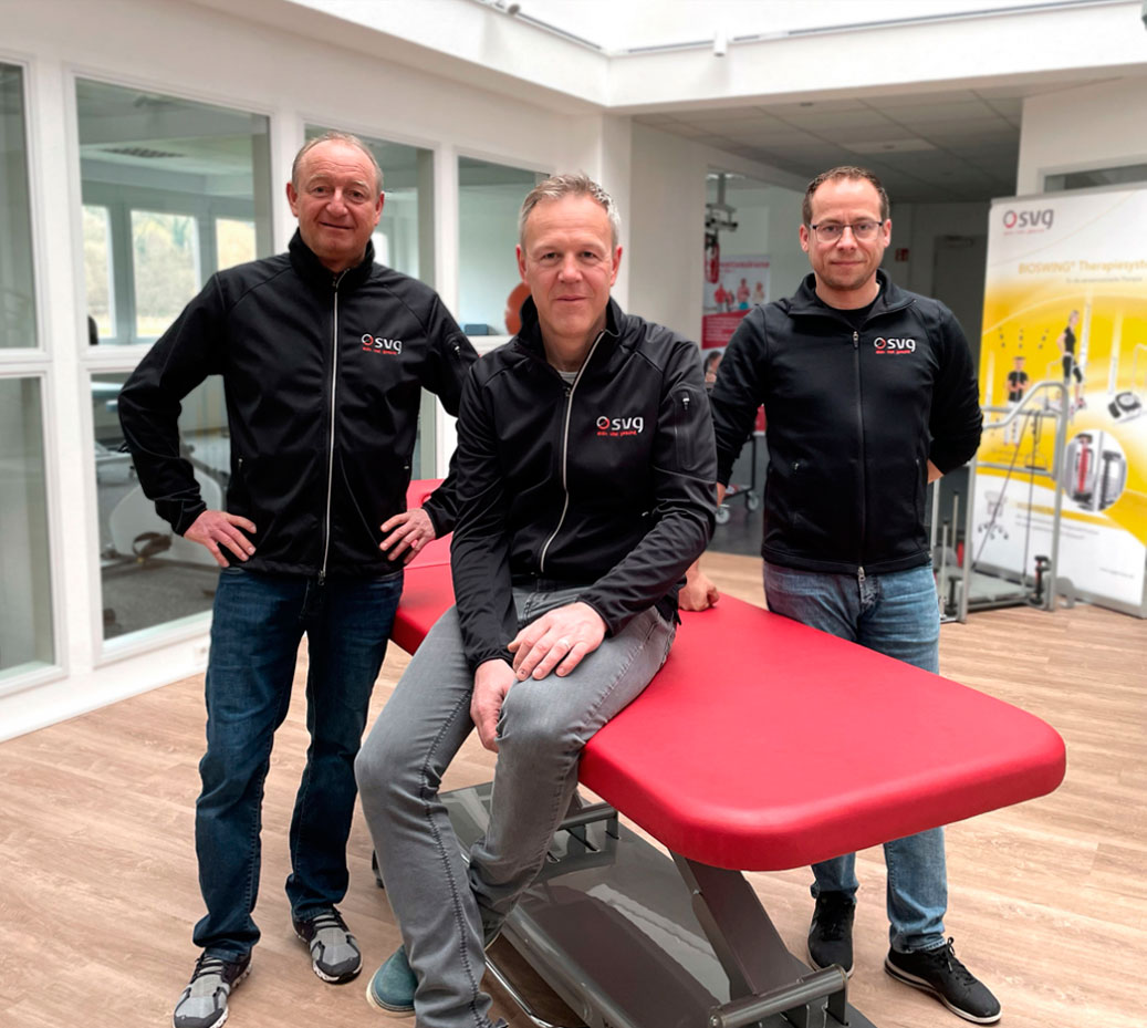 SVG team posing on a therapy table