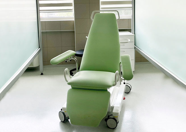 green blood donor chair in laboratory